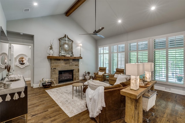 living area featuring plenty of natural light, beam ceiling, dark wood-style floors, and visible vents