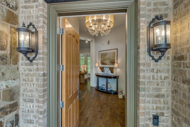13998 Windham Dr, Van Alstyne, TX 75495 - hallway with wood finished floors and a chandelier