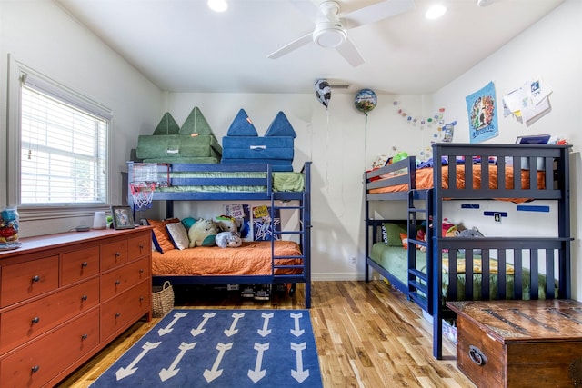 bedroom with wood finished floors and recessed lighting
