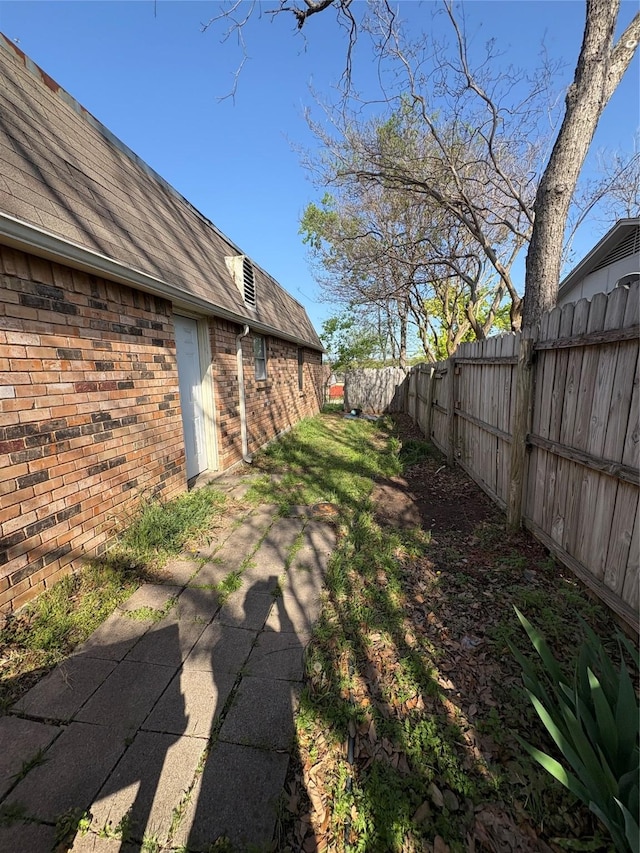 view of yard featuring a fenced backyard and a patio area