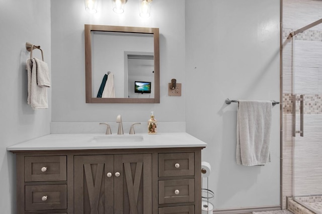 bathroom featuring vanity and a shower stall