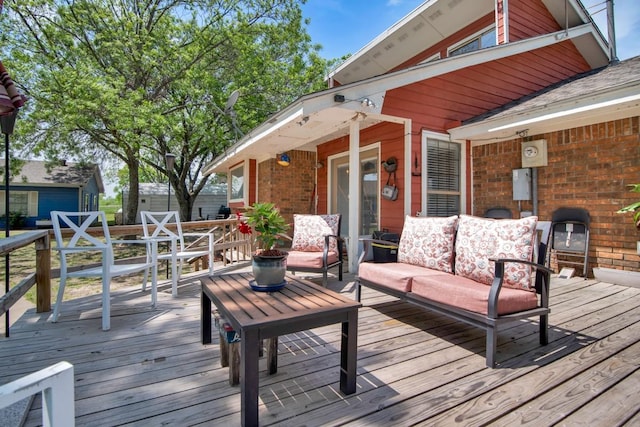 wooden deck featuring an outdoor hangout area