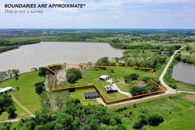 drone / aerial view featuring a rural view and a water view
