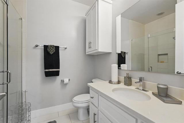 bathroom with toilet, baseboards, tile patterned flooring, a shower stall, and vanity