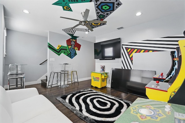 recreation room featuring recessed lighting, wood finished floors, visible vents, and a ceiling fan