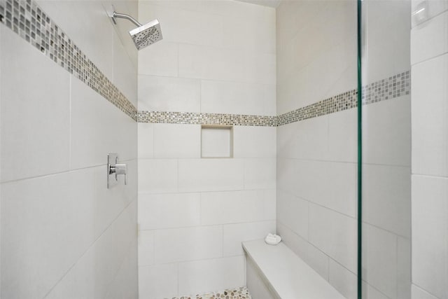 bathroom featuring tiled shower