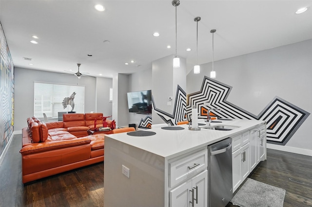 kitchen featuring a sink, dishwasher, a center island with sink, baseboards, and recessed lighting