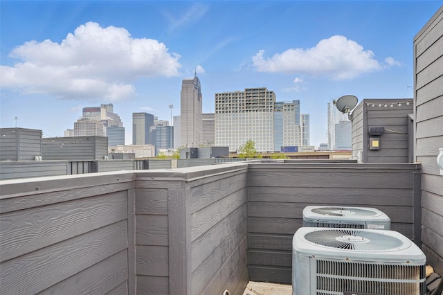 balcony with central AC and a view of city