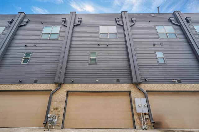 back of property with a garage