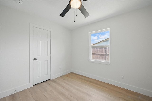 empty room with light wood-type flooring, baseboards, and ceiling fan