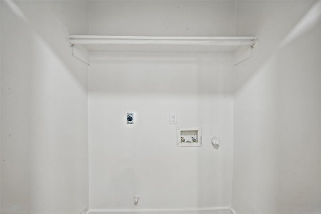 laundry area with electric dryer hookup, gas dryer hookup, hookup for a washing machine, and laundry area