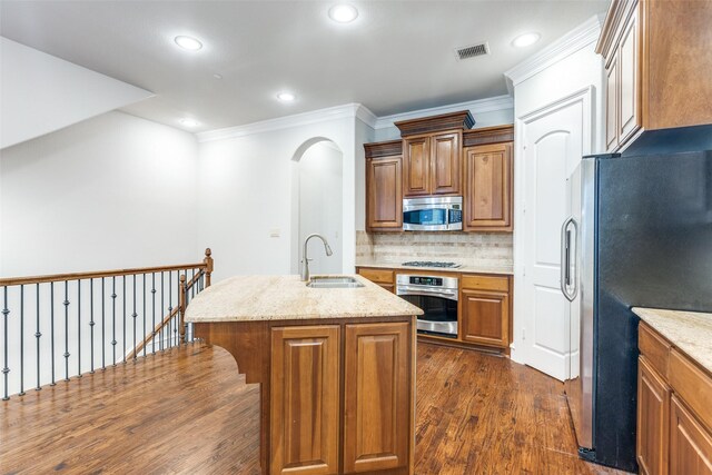 kitchen featuring a sink, crown molding, stainless steel dishwasher, and dark wood-type flooring