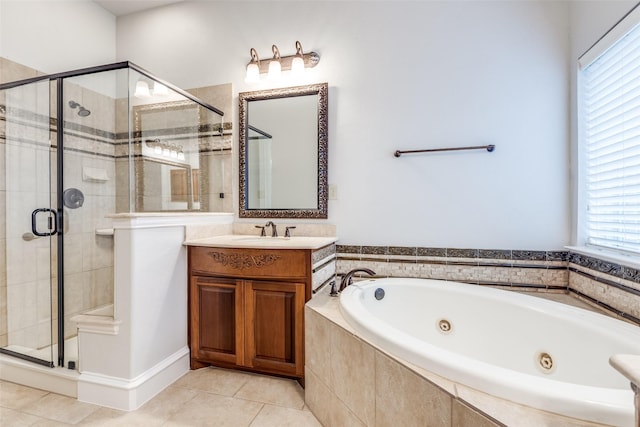 bathroom featuring a healthy amount of sunlight, tile patterned flooring, and a stall shower