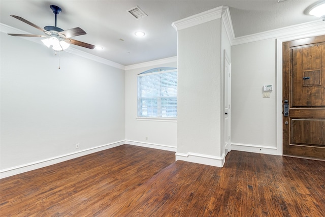 entrance foyer featuring crown molding, a ceiling fan, baseboards, wood finished floors, and visible vents