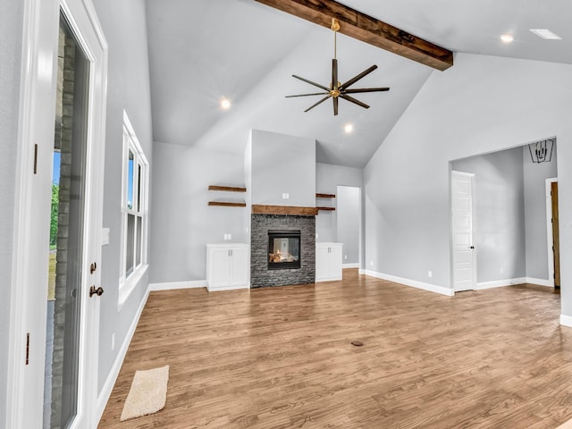 117 Fan Mill Trl, Weatherford, TX 76085 - unfurnished living room with beam ceiling, light wood finished floors, high vaulted ceiling, and ceiling fan