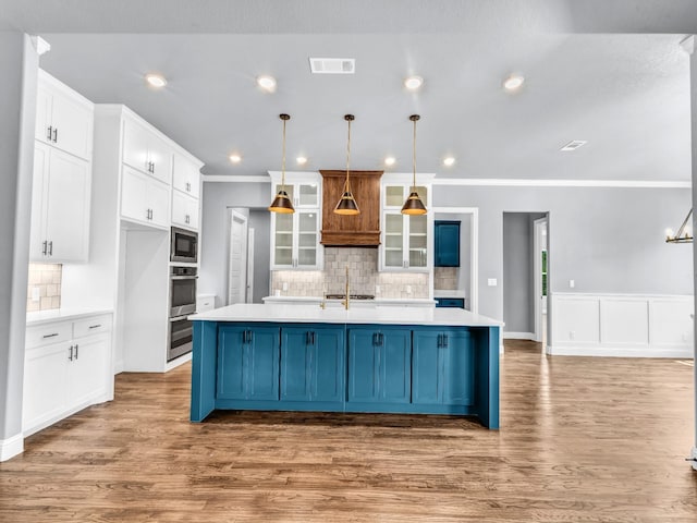 117 Fan Mill Trl, Weatherford, TX 76085 - kitchen with backsplash, visible vents, built in microwave, and white cabinetry
