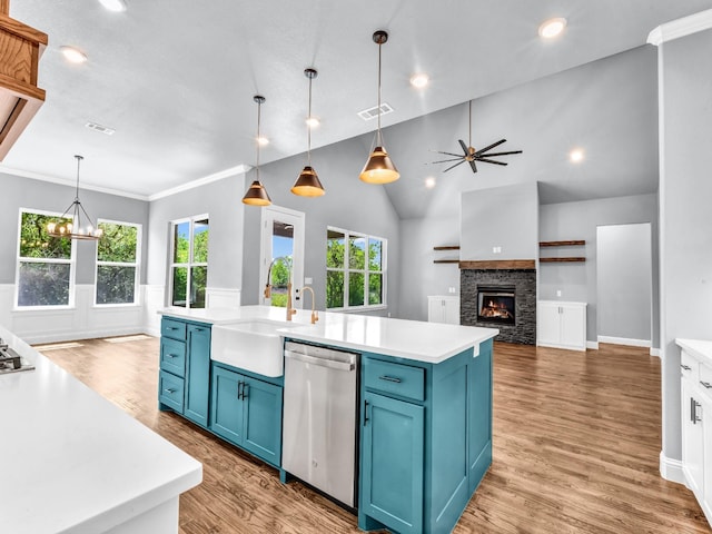 117 Fan Mill Trl, Weatherford, TX 76085 - kitchen with light countertops, stainless steel dishwasher, blue cabinets, and a sink