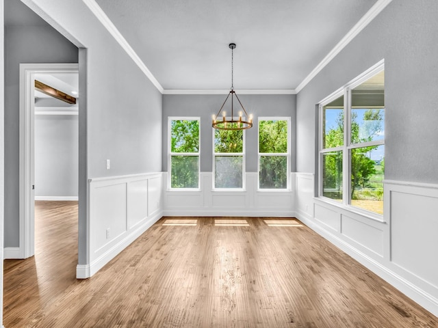 117 Fan Mill Trl, Weatherford, TX 76085 - unfurnished dining area with wainscoting, a notable chandelier, and wood finished floors
