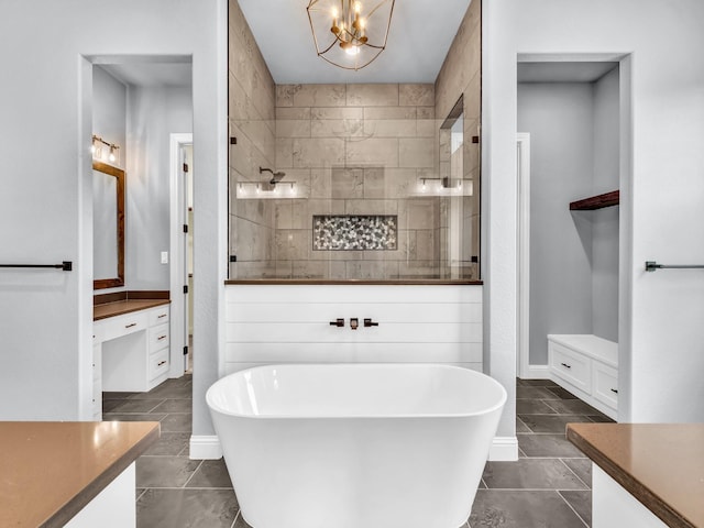 117 Fan Mill Trl, Weatherford, TX 76085 - full bathroom with tile patterned floors, vanity, an inviting chandelier, walk in shower, and a soaking tub