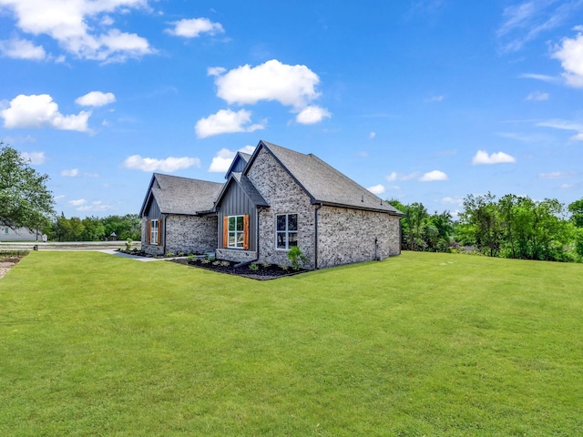 117 Fan Mill Trl, Weatherford, TX 76085 - view of side of home with board and batten siding, a lawn, and stone siding