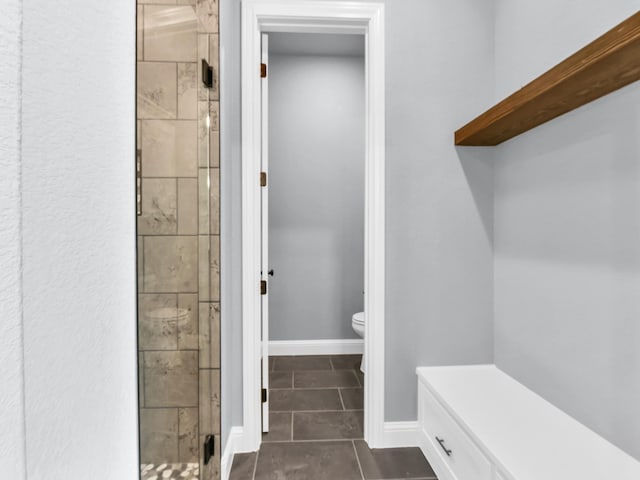 117 Fan Mill Trl, Weatherford, TX 76085 - full bathroom with baseboards, tile patterned flooring, a shower stall, and toilet
