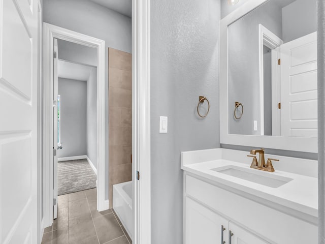 117 Fan Mill Trl, Weatherford, TX 76085 - bathroom featuring baseboards, tile patterned flooring, vanity, and bathing tub / shower combination