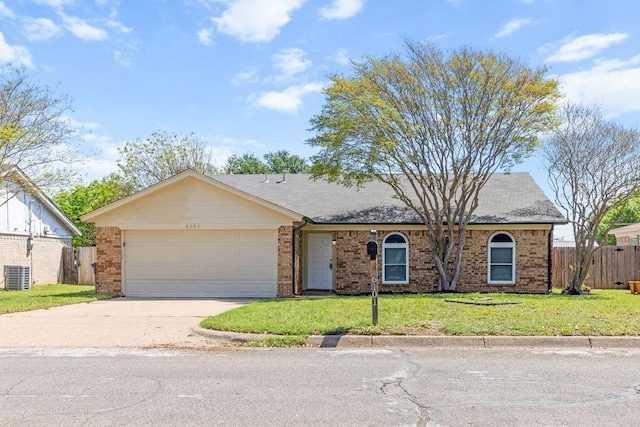 ranch-style home featuring a garage, concrete driveway, fence, a front yard, and brick siding