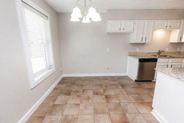 kitchen featuring dishwasher, light stone countertops, white cabinetry, and a sink