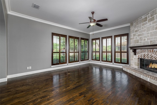 unfurnished living room featuring a ceiling fan, a healthy amount of sunlight, a stone fireplace, and visible vents