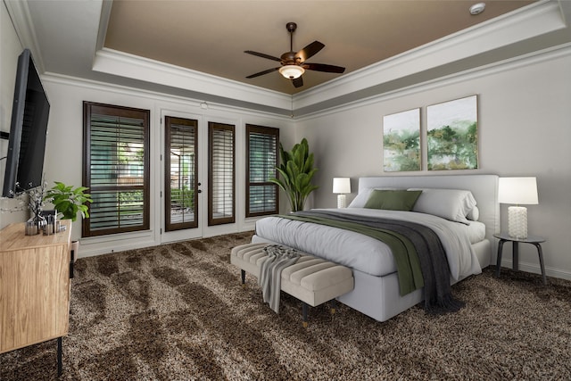 bedroom featuring a tray ceiling, access to outside, carpet flooring, and crown molding