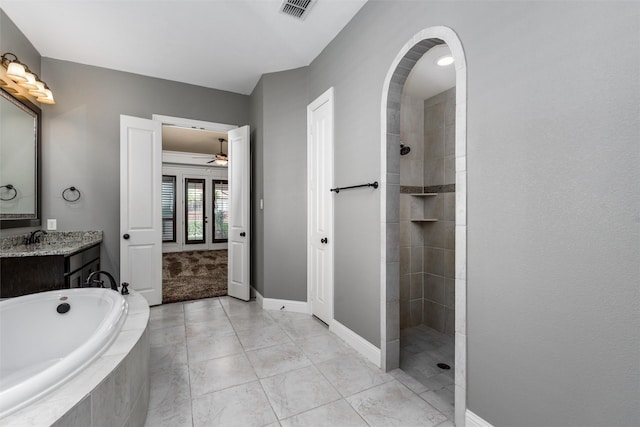 bathroom with a bath, visible vents, vanity, and a walk in shower