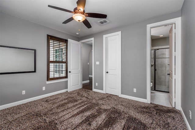 unfurnished bedroom with carpet flooring, baseboards, visible vents, a ceiling fan, and connected bathroom