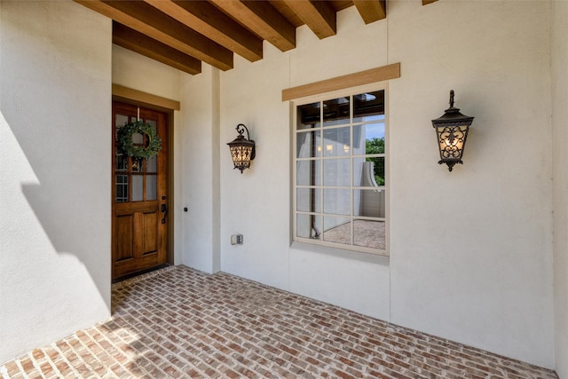 doorway to property with stucco siding