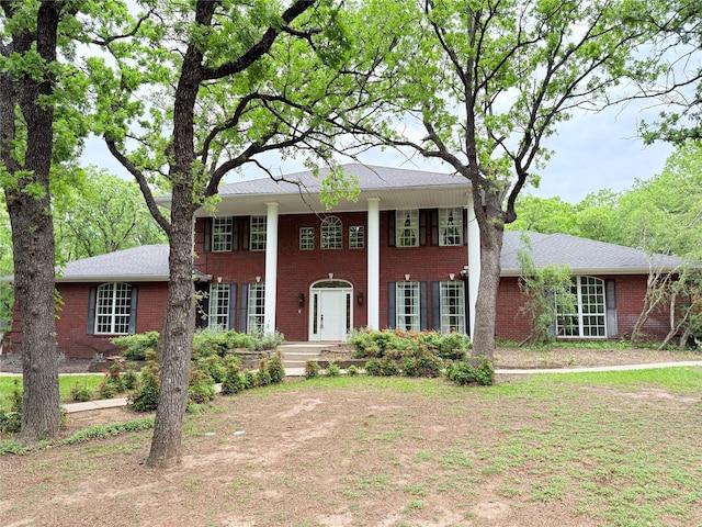 516 Wild Wood Dr, Decatur, TX 76234 - neoclassical / greek revival house with brick siding and a porch