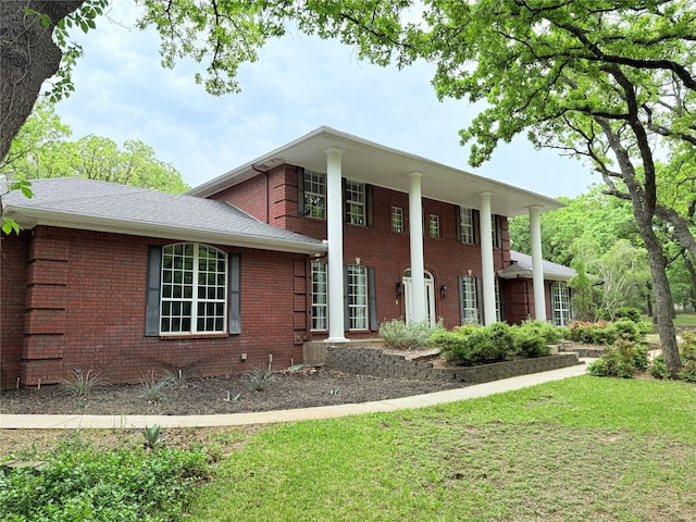 516 Wild Wood Dr, Decatur, TX 76234 - greek revival house featuring a front yard and brick siding