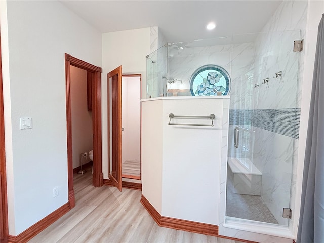 516 Wild Wood Dr, Decatur, TX 76234 - bathroom featuring a marble finish shower, wood finished floors, and recessed lighting
