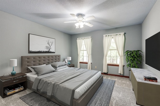516 Wild Wood Dr, Decatur, TX 76234 - bedroom featuring light colored carpet, a textured ceiling, and a ceiling fan