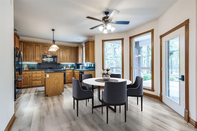 516 Wild Wood Dr, Decatur, TX 76234 - dining room with light wood-type flooring and a ceiling fan