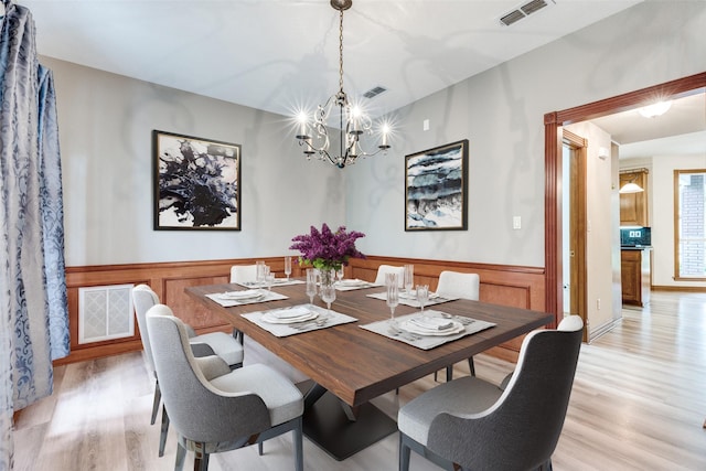 516 Wild Wood Dr, Decatur, TX 76234 - dining room with a chandelier, wainscoting, and light wood-style floors