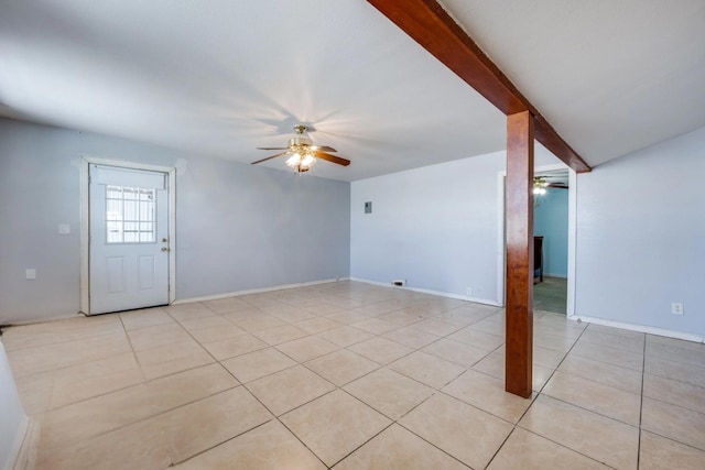 unfurnished living room featuring light tile patterned floors, baseboards, and ceiling fan