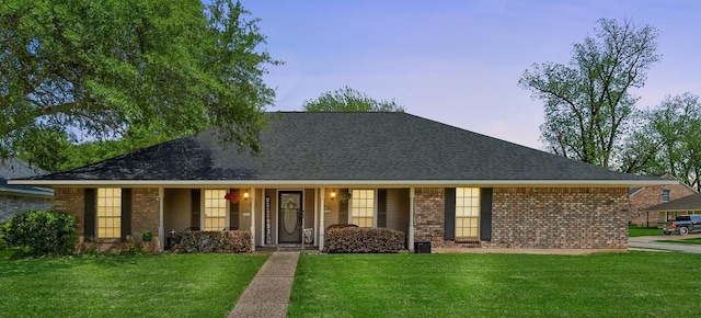 5021 Kenilworth Dr, Bossier City, LA 71112 - view of front of house featuring a front yard, brick siding, a porch, and roof with shingles