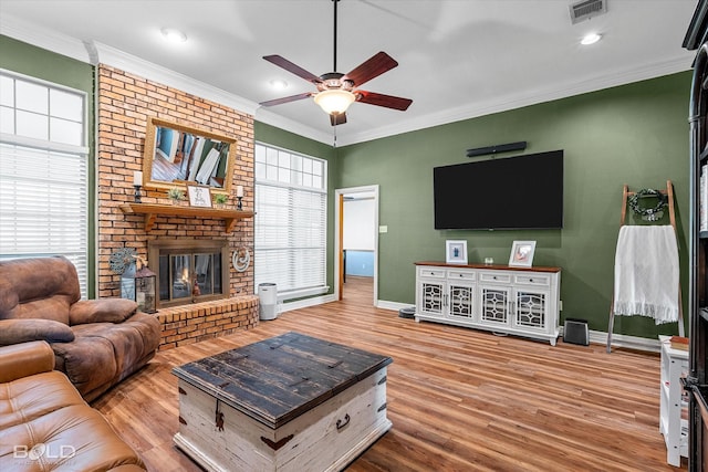 5021 Kenilworth Dr, Bossier City, LA 71112 - living area featuring baseboards, a ceiling fan, ornamental molding, wood finished floors, and a brick fireplace