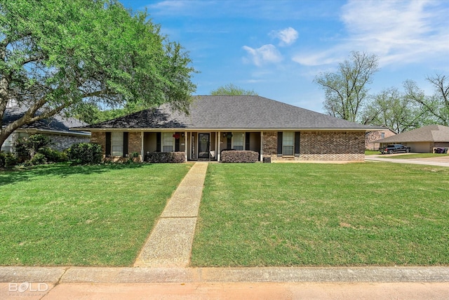 5021 Kenilworth Dr, Bossier City, LA 71112 - ranch-style home featuring a front lawn, brick siding, a porch, and roof with shingles