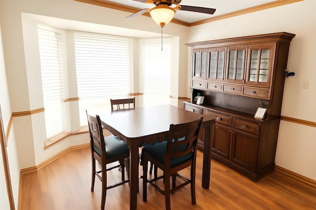 5021 Kenilworth Dr, Bossier City, LA 71112 - dining room with a ceiling fan, light wood-type flooring, ornamental molding, and baseboards