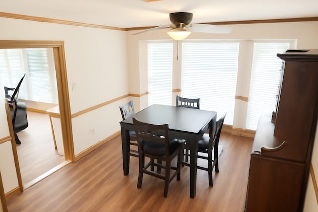 5021 Kenilworth Dr, Bossier City, LA 71112 - dining area featuring a ceiling fan, light wood-style floors, baseboards, crown molding, and healthy amount of natural light