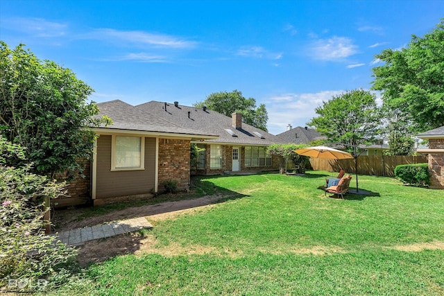 5021 Kenilworth Dr, Bossier City, LA 71112 - rear view of property featuring a chimney and brick siding