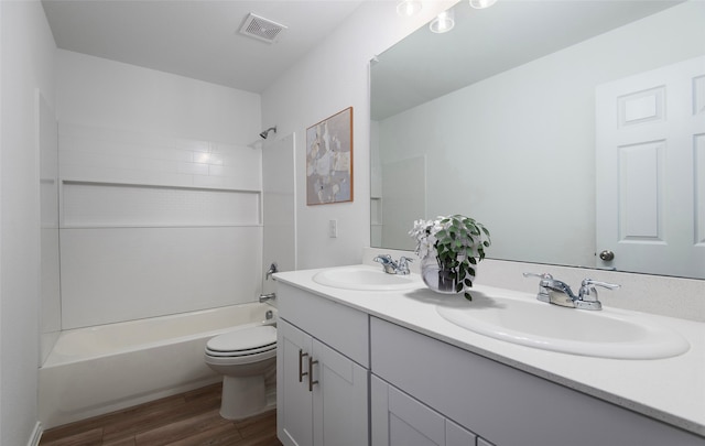 14151 Maida Dr, Pilot Point, TX 76258 - bathroom with wood finished floors, visible vents, a sink, and toilet