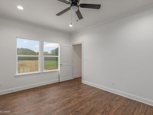 unfurnished room featuring ceiling fan, baseboards, ornamental molding, and wood finished floors