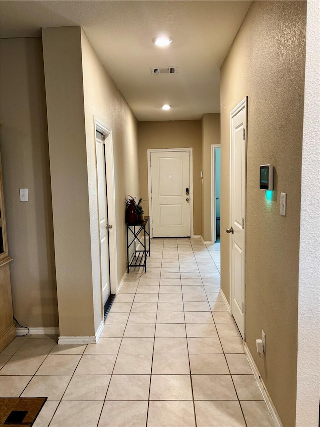 828 Costlow Ln, Fate, TX 75189 - corridor featuring light tile patterned flooring and baseboards