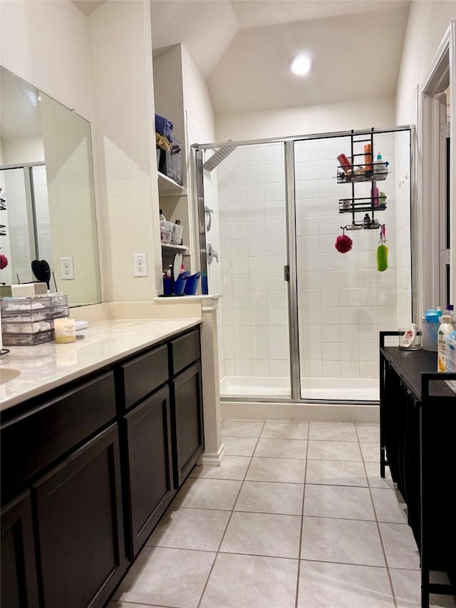 828 Costlow Ln, Fate, TX 75189 - bathroom with vanity, a shower stall, tile patterned floors, and lofted ceiling